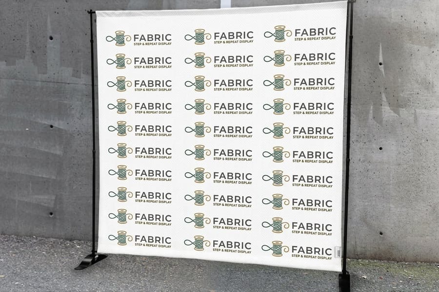 Step-and-repeat from 4OVER4 with staggered logos spaced to stay visible behind people