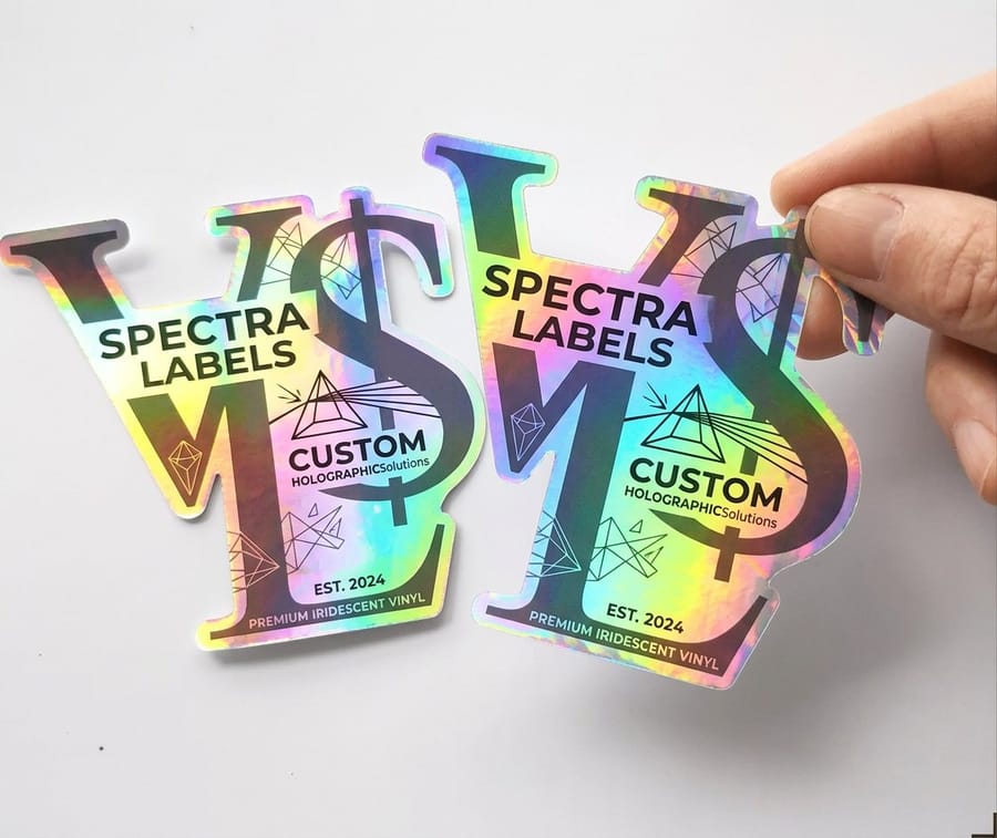 Holographic labels printed by 4OVER4 showing the rainbow diffraction pattern of holographic foil