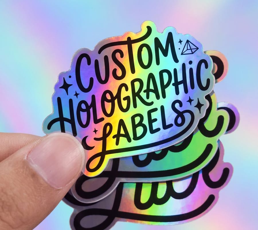 Die cut custom holographic label from 4OVER4 with bold hand lettered type that stays legible on a shiny surface