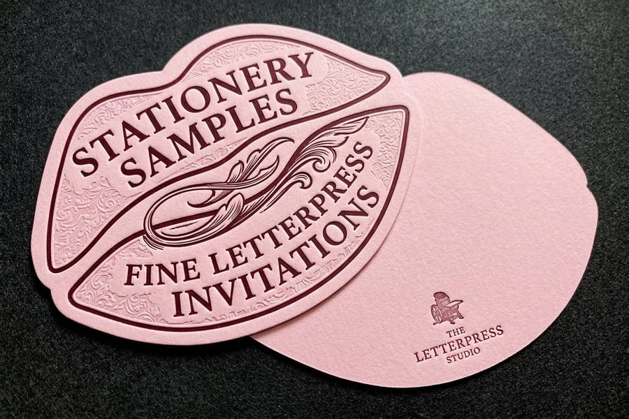 Letterpress invitations printed by 4OVER4 showing the pressed impression in thick stock