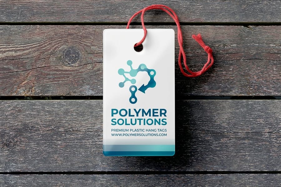 Durable plastic hang tags printed by 4OVER4 in several sizes with drilled holes