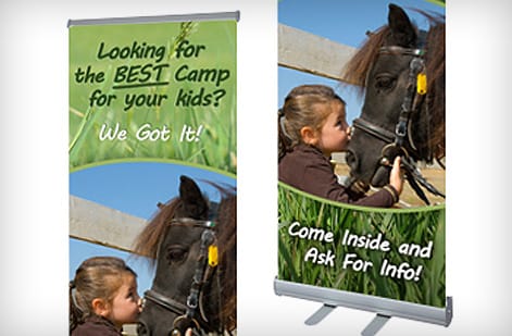 Assembled banner stand display sized for a booth, printed by 4OVER4
