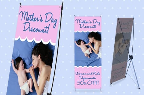 Pop-up backdrop next to a retractable banner by 4OVER4