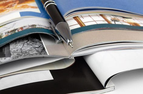 Inside spread of a trade show program showing an exhibitor directory and floor map, printed by 4OVER4.COM