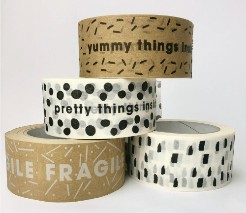 Repeating logo artwork laid out for custom packing tape, 4OVER4 file setup