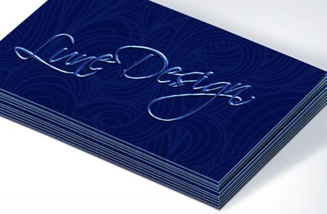 A business card proof being checked at full zoom before printing from 4OVER4